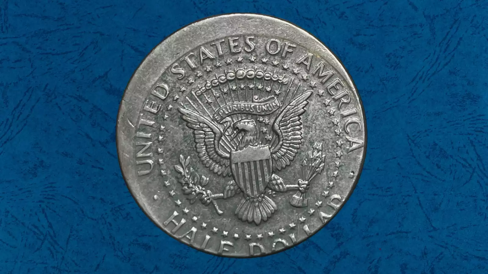 1986 Kennedy half dollar off-center strike error showing design shifted from center of planchet
